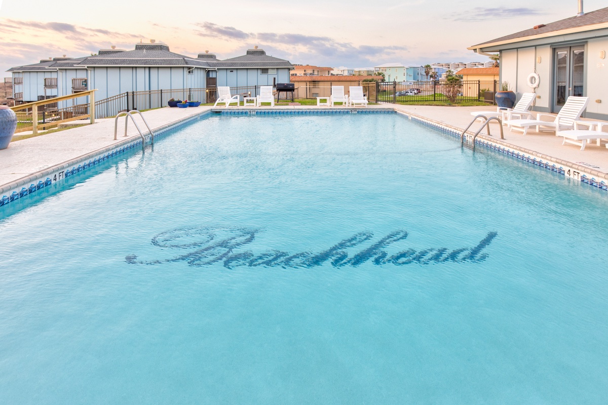 Dive into your private oasis with this sparkling pool where refreshing swims await under open skies.