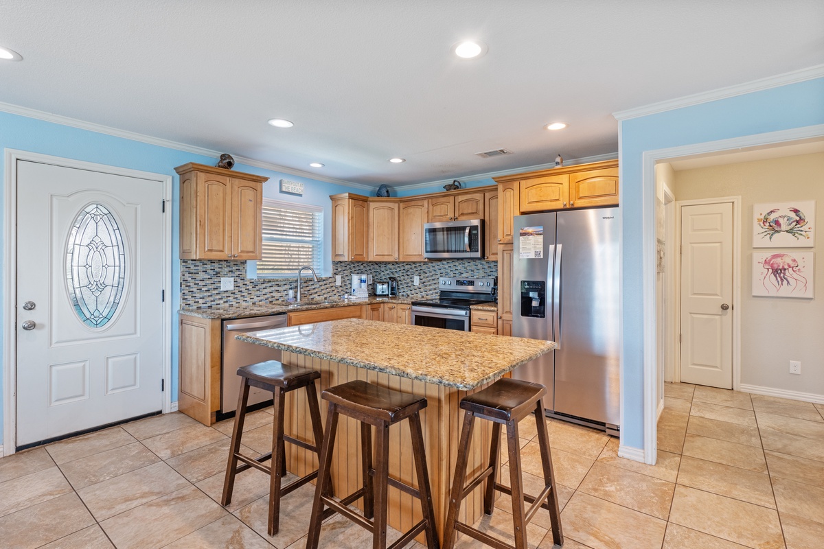 Cook memorable meals in your spacious kitchen featuring granite countertops, stainless steel appliances, and a breakfast bar perfect for morning coffee.
