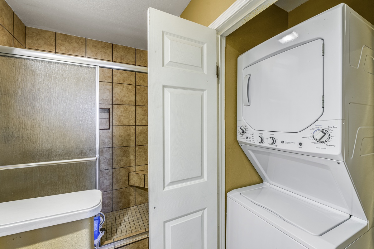 Freshen up with ease in your private bathroom featuring a tiled shower and convenient in-unit washer dryer combo.