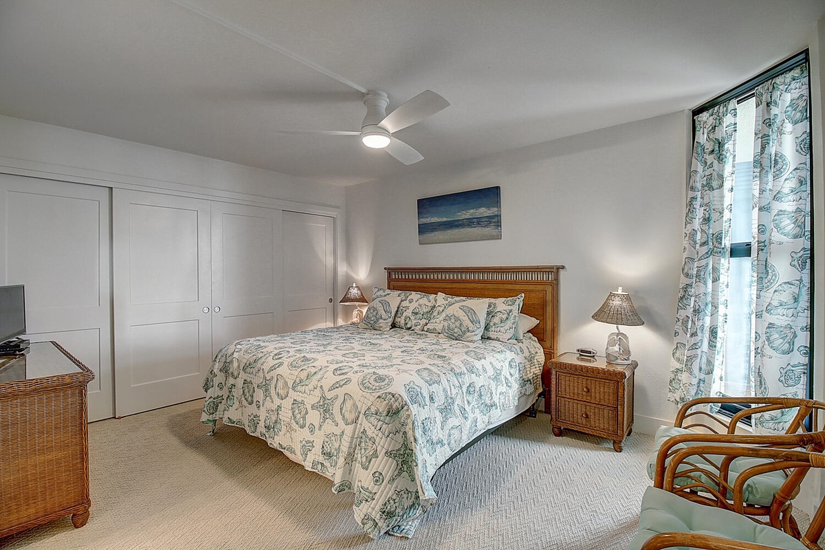 Drift into restful sleep in your coastal-themed bedroom, where ocean-inspired decor and gentle ceiling fan breezes create perfect serenity.