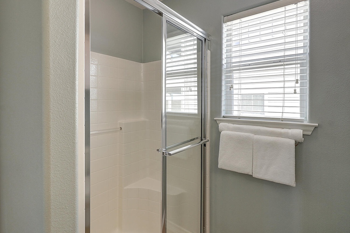 Step into your bright, sparkling clean shower with fresh towels waiting nearby—your perfect morning refresh awaits.