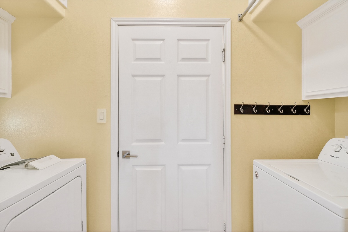 Your dedicated laundry room keeps your vacation wardrobe fresh with full-size washer and dryer plus convenient storage hooks.