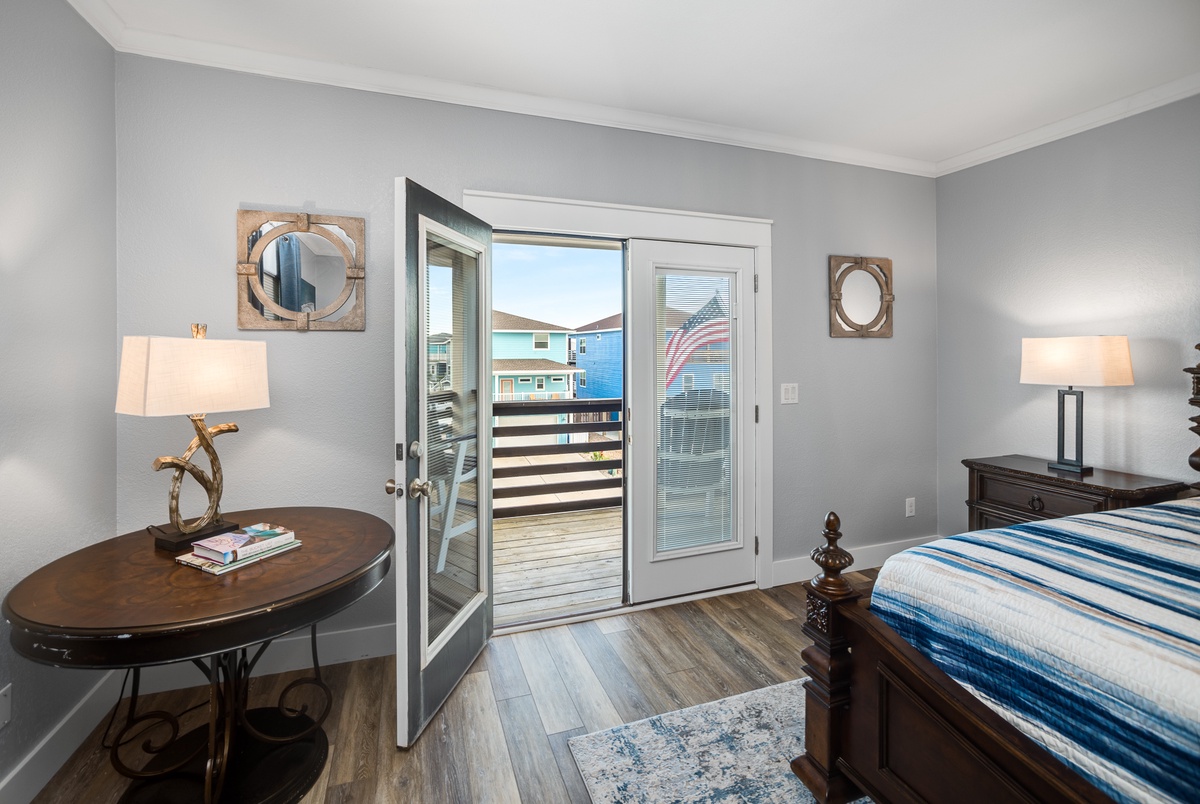 Step onto your private balcony for morning coffee with waterfront views in this cozy bedroom retreat.