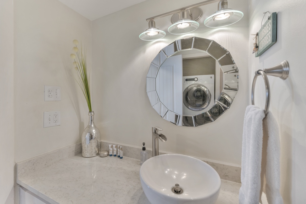 Refresh in your elegant bathroom featuring modern fixtures, stylish mirror, and gleaming countertops that make your daily routine feel luxurious.