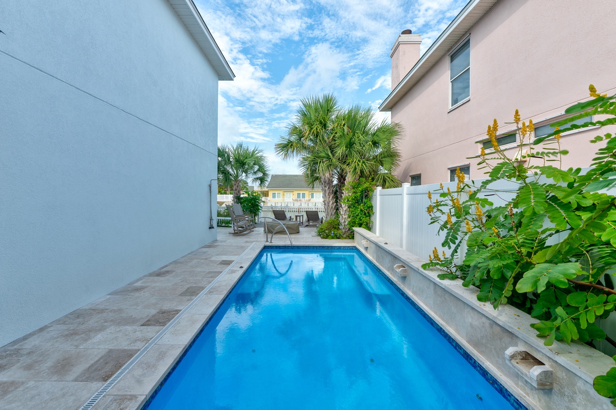 Your private pool invites you to float beneath swaying palms and endless blue skies, a tranquil oasis steps from your door.