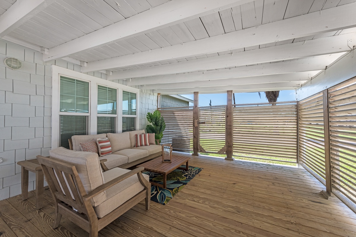 Unwind on your private covered deck with comfortable seating and natural wood details creating the perfect outdoor retreat.