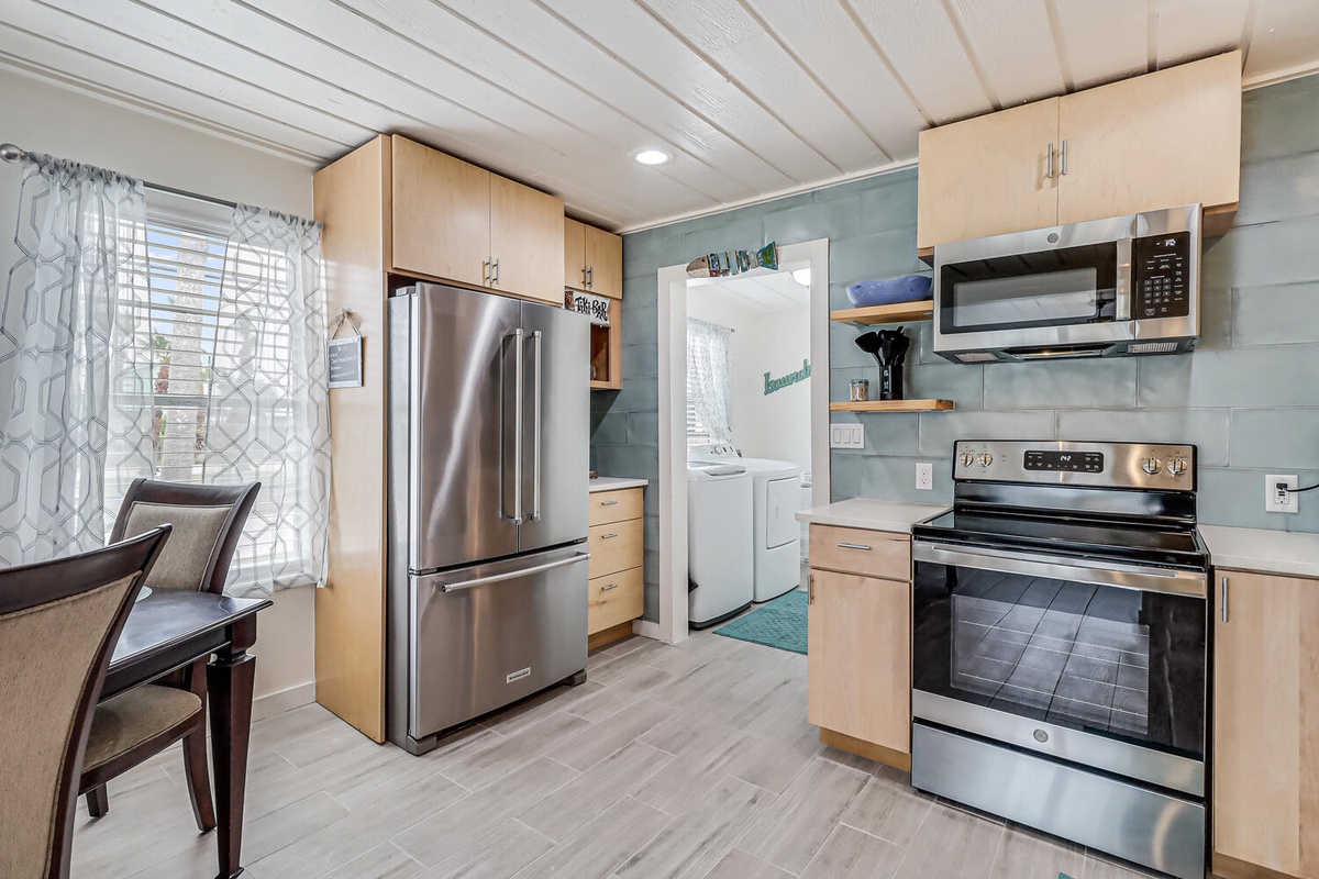 Your fully equipped kitchen awaits with stainless steel appliances, ample counter space, and everything you need to create memorable meals during your stay.