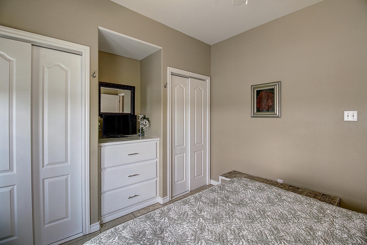 Relax in your peaceful bedroom with smart built-in storage, flat-screen TV, and all the comforts you need for a restful stay.