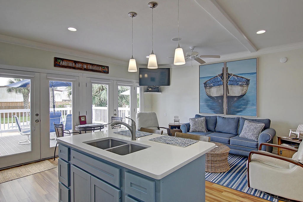 Relax in your coastal haven where the open kitchen flows into comfortable living space, complete with tropical views and nautical charm.
