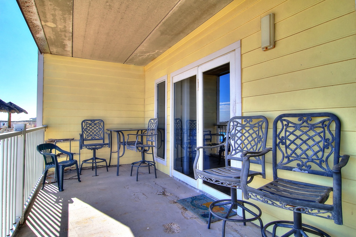 Your private balcony offers comfortable seating where you can enjoy morning coffee or evening relaxation with ocean breezes.