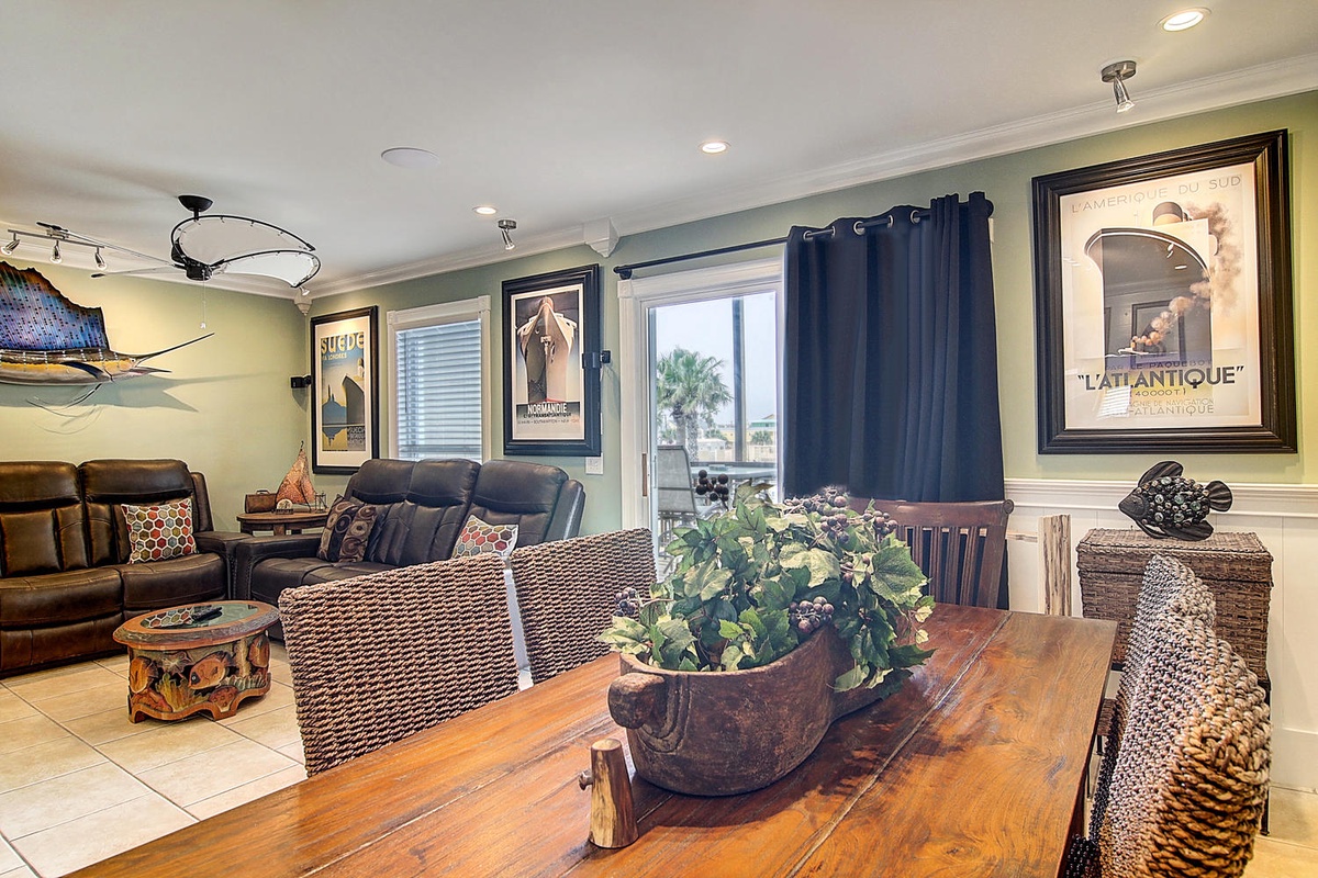 Unwind in your stylish living space where vintage nautical art meets modern comfort. Natural light fills the room creating perfect ambiance.