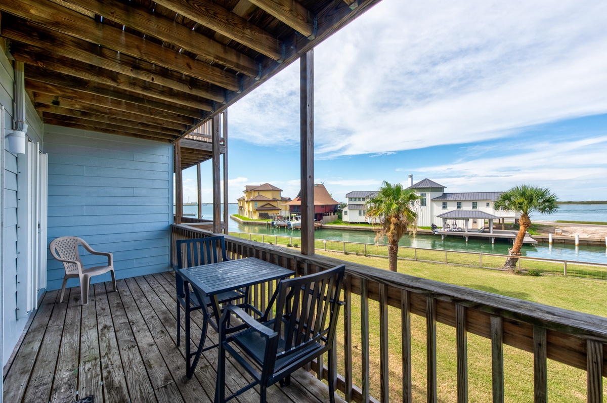 Unwind on your private deck with waterfront views, watching boats drift by while palm trees sway in the coastal breeze.