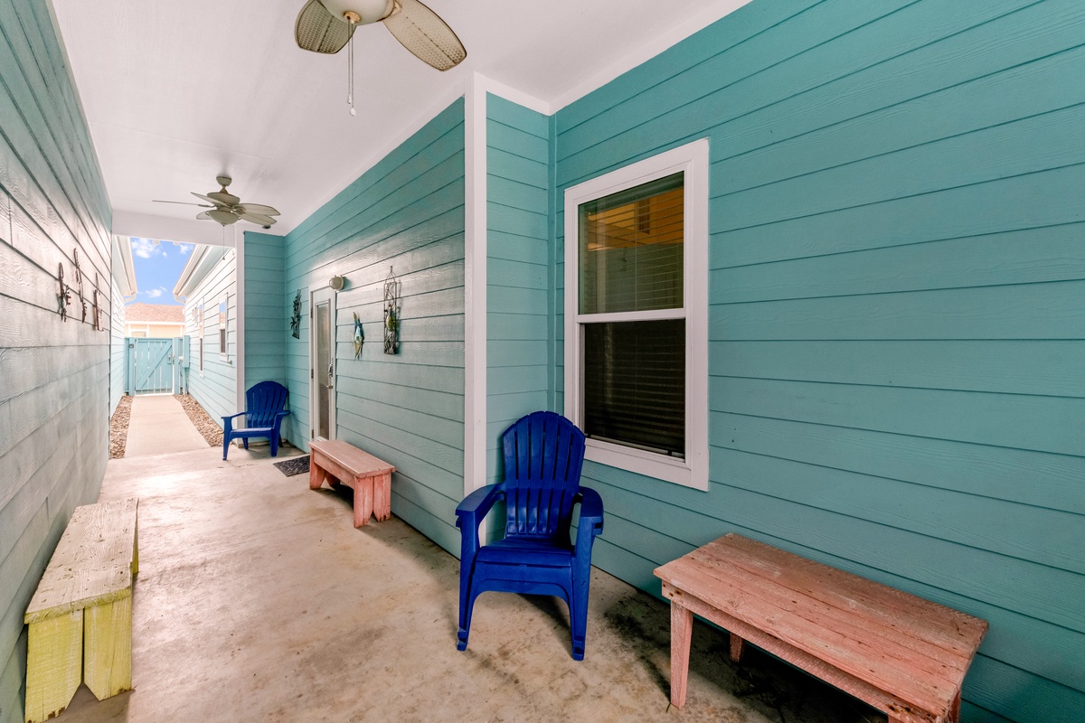 Relax on your covered patio with comfortable seating and ceiling fans keeping you cool in the coastal breeze.