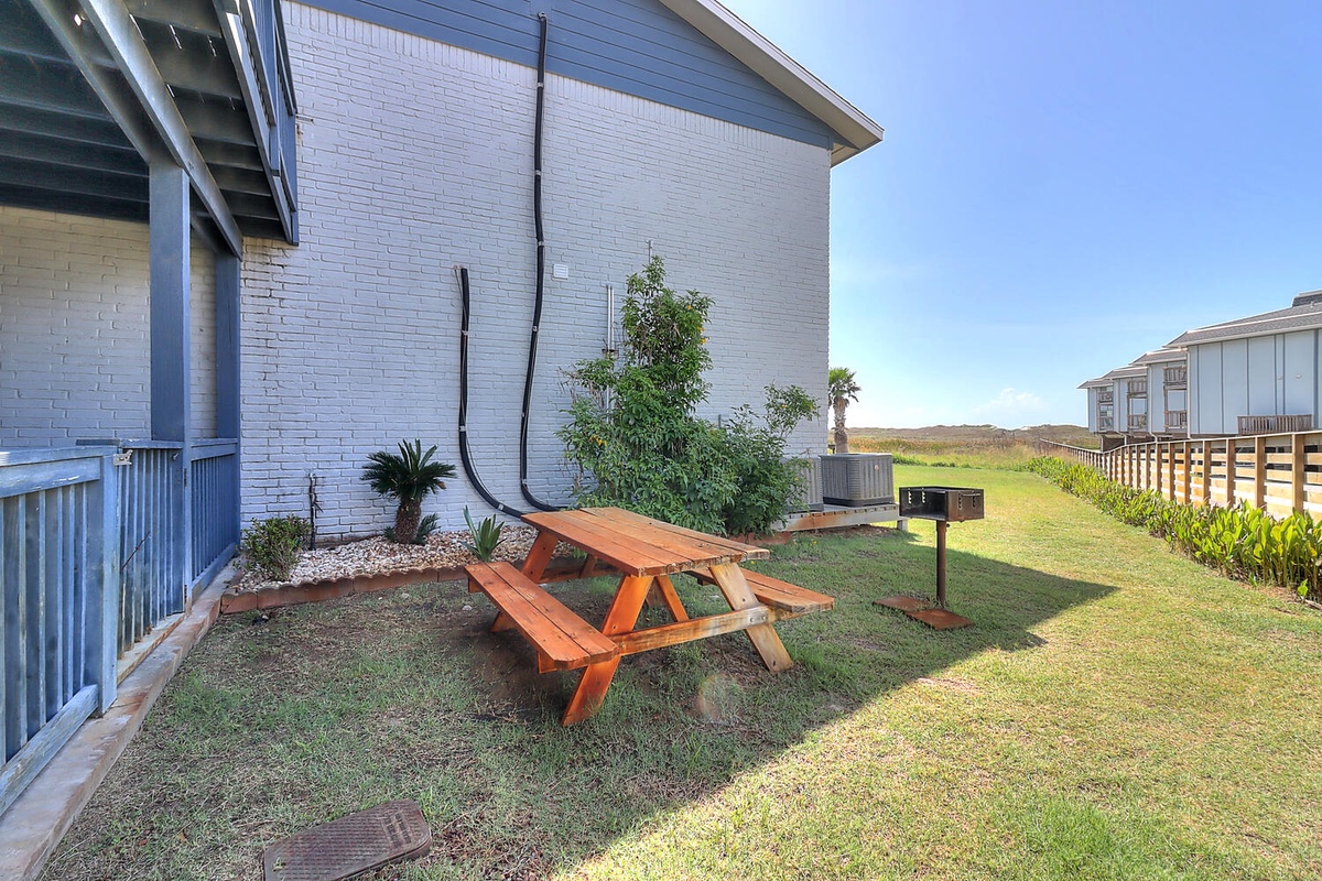Your private yard features a picnic table and BBQ grill, perfect for outdoor dining with scenic open space views.