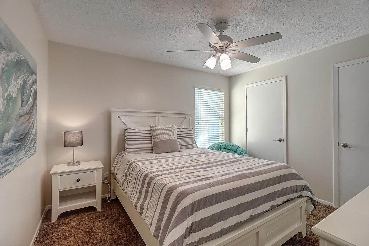 Drift off in your comfortable bedroom with crisp linens and gentle ceiling fan keeping you cool all night.