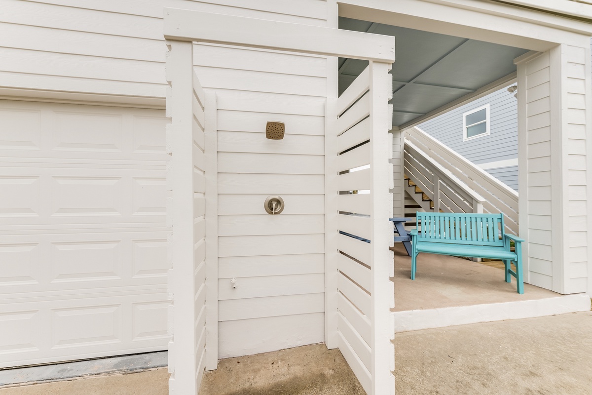 Fresh coastal charm meets modern comfort in your private outdoor shower, perfectly positioned for post-beach rinses with ocean-inspired style.