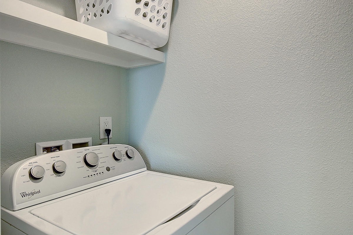 Keep your clothes fresh during your stay with this convenient in-unit washer and organized storage space.