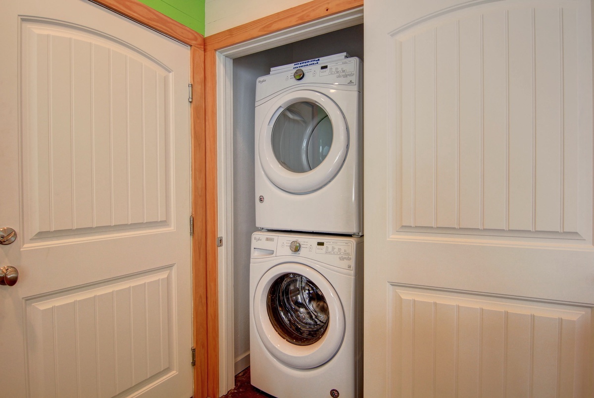 Your own private washer and dryer await, neatly tucked away in this convenient laundry closet for ultimate comfort during your stay.
