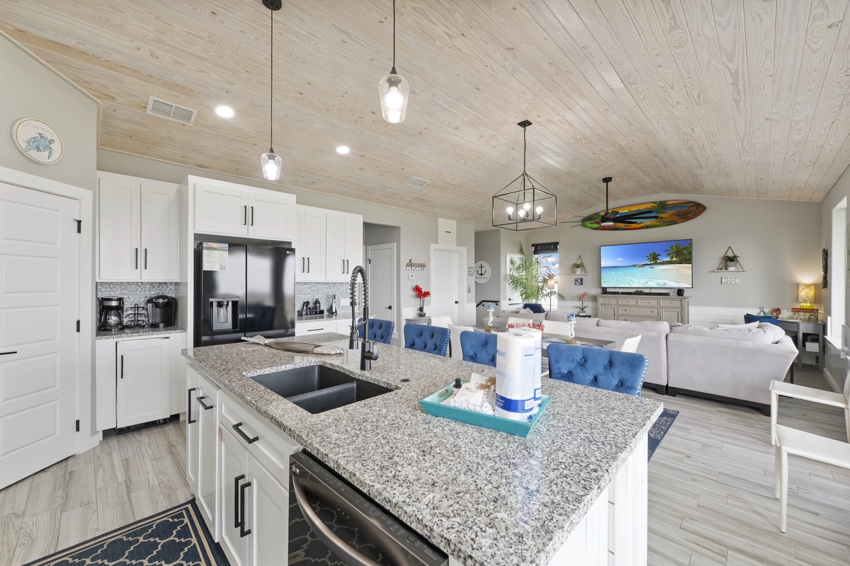 Your spacious kitchen flows seamlessly into the living area, perfect for gathering with loved ones while you cook.