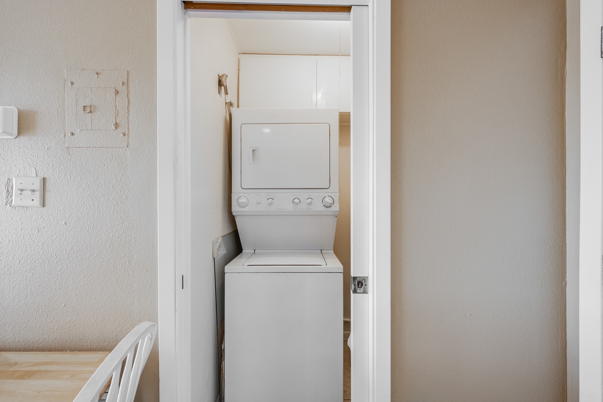 Your in-unit washer and dryer tucked neatly in a closet make extended stays effortless and convenient.