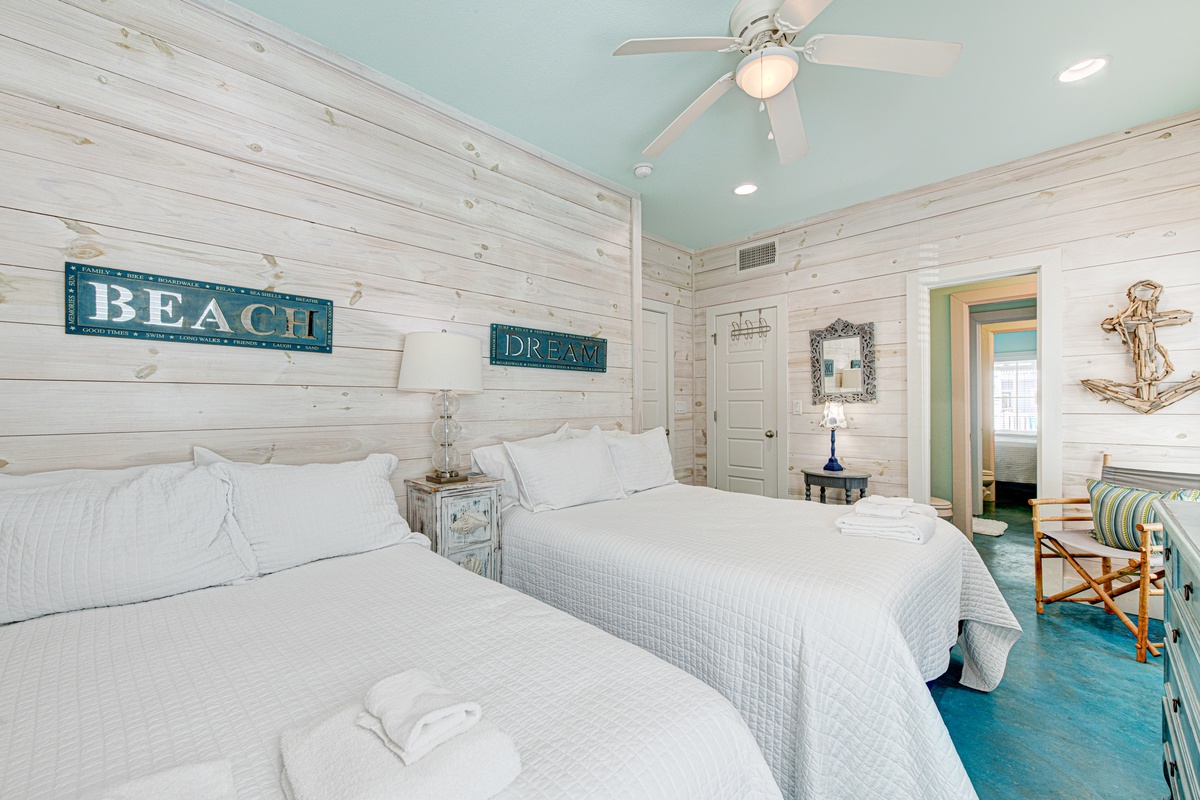 Drift off to sleep in this charming coastal bedroom where whitewashed wood and nautical touches create your perfect seaside retreat.