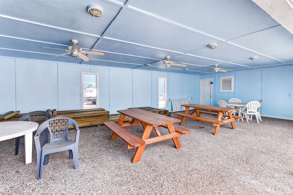 Gather with friends in your private covered patio, where comfortable seating and picnic tables create the perfect spot for meals and relaxation.