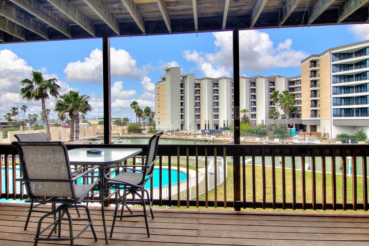 Relax on your private balcony with pool and water views, perfect for morning coffee or evening cocktails.