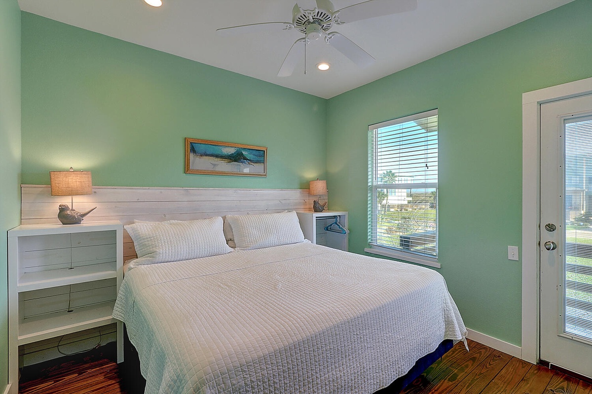 Drift off in your tranquil bedroom with soothing mint walls, soft linens, and gentle bedside lighting creating the perfect coastal retreat.