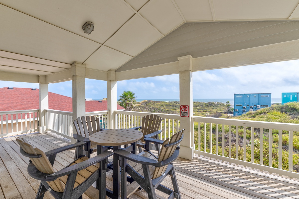 Unwind on your private covered terrace with comfortable seating and peaceful views of the surrounding natural landscape.