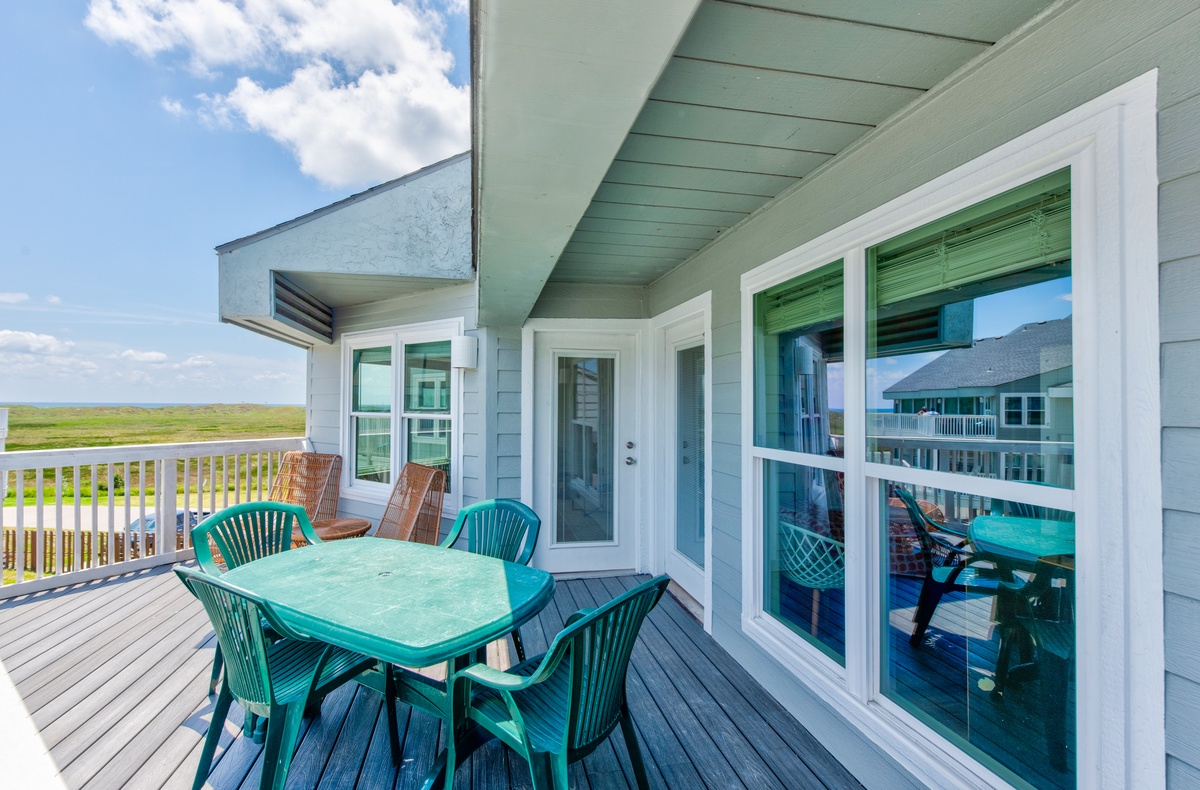 Relax on your private deck with outdoor dining and sweeping views of coastal marshland stretching to the horizon.