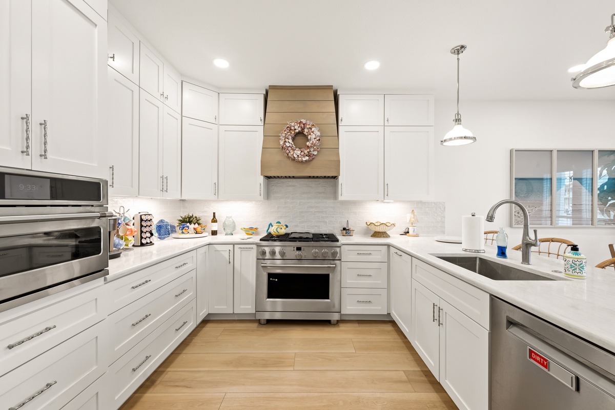 Cook up a feast in this bright, modern kitchen with gleaming countertops, stainless steel appliances, and ample storage to make your stay effortless.