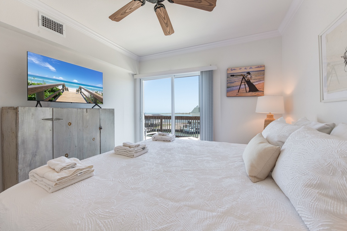 Wake up to stunning ocean views from your coastal bedroom, where soft white linens and beach-inspired décor create pure serenity.