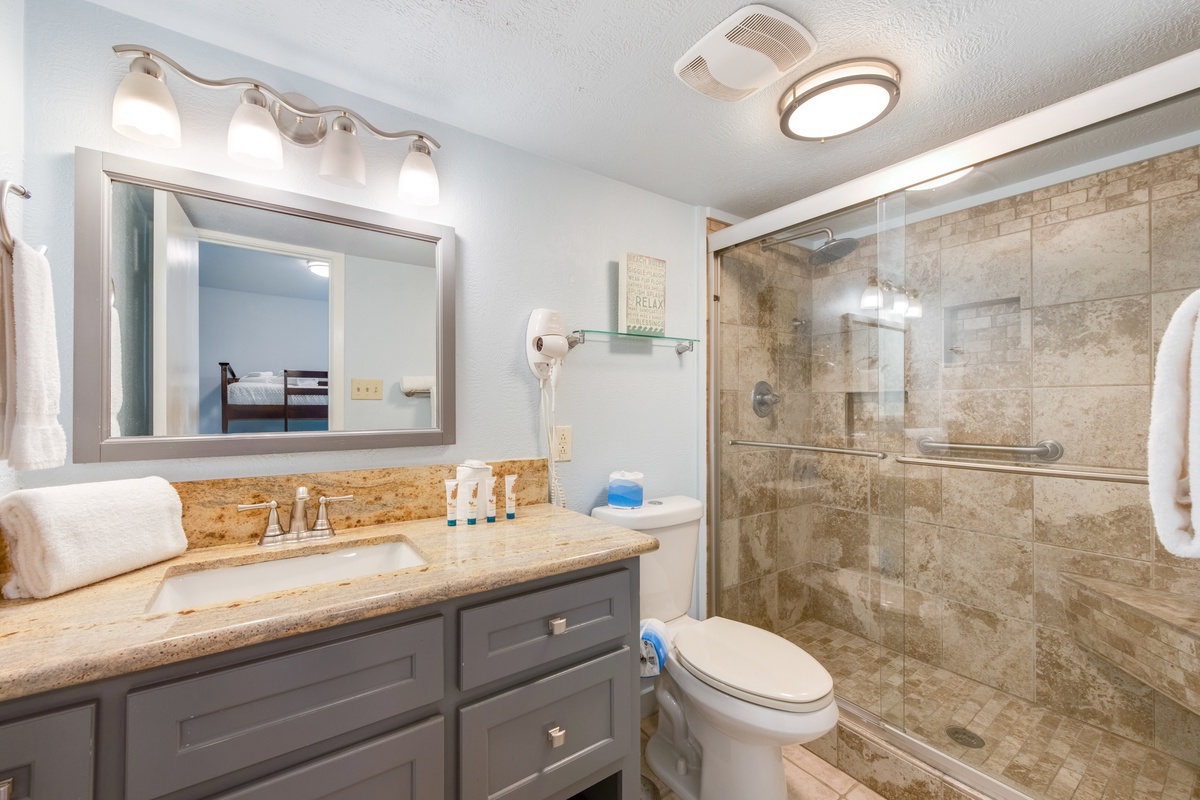 Step into your private spa-like retreat with elegant granite counters, spacious glass shower, and premium finishes throughout.