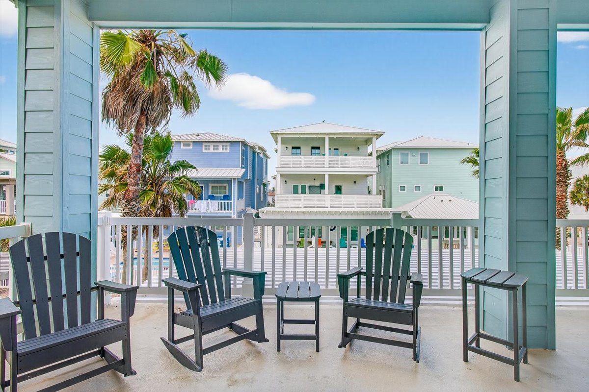 Step onto your private balcony and sink into comfortable Adirondack chairs overlooking colorful beach houses and swaying palms.