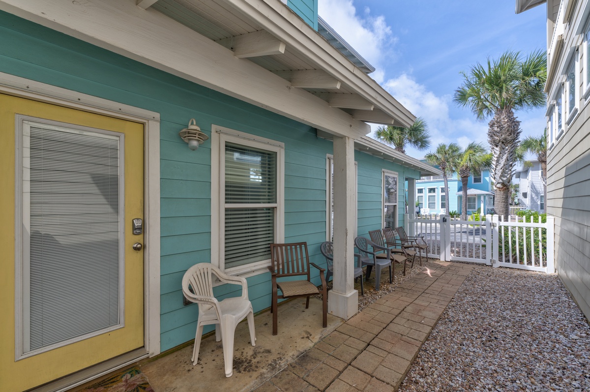 Your private patio awaits with outdoor seating and BBQ grill, perfect for morning coffee or evening cookouts in this charming coastal setting.