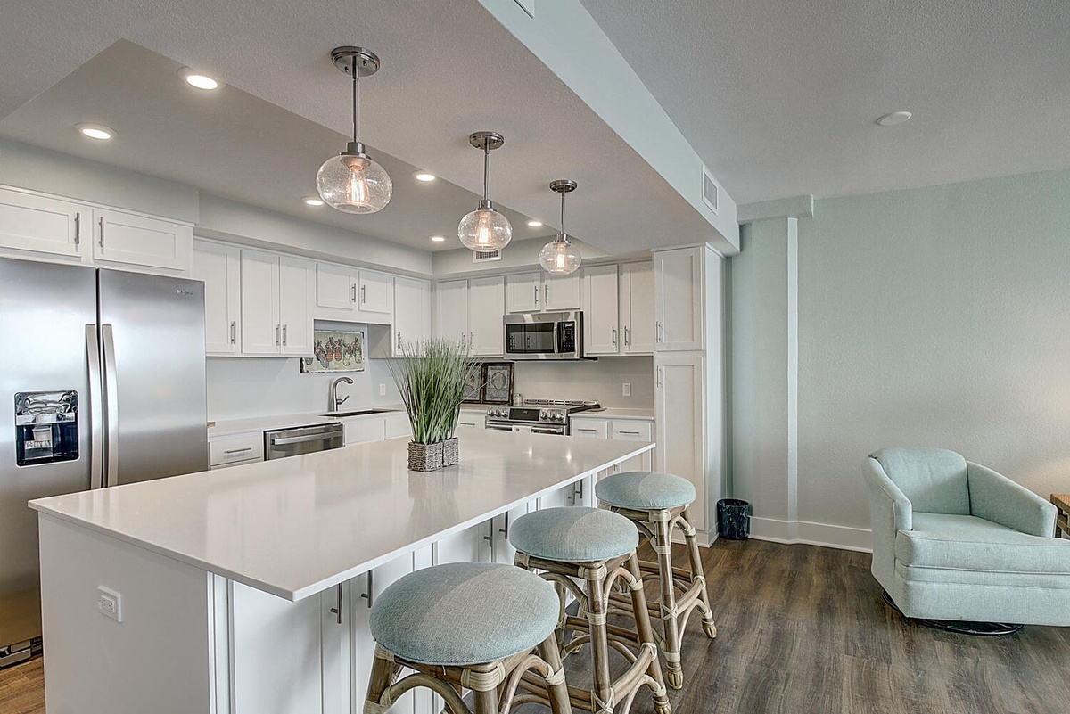 Your dream kitchen awaits with gleaming quartz counters, modern appliances, and a spacious island perfect for morning coffee or evening conversations.