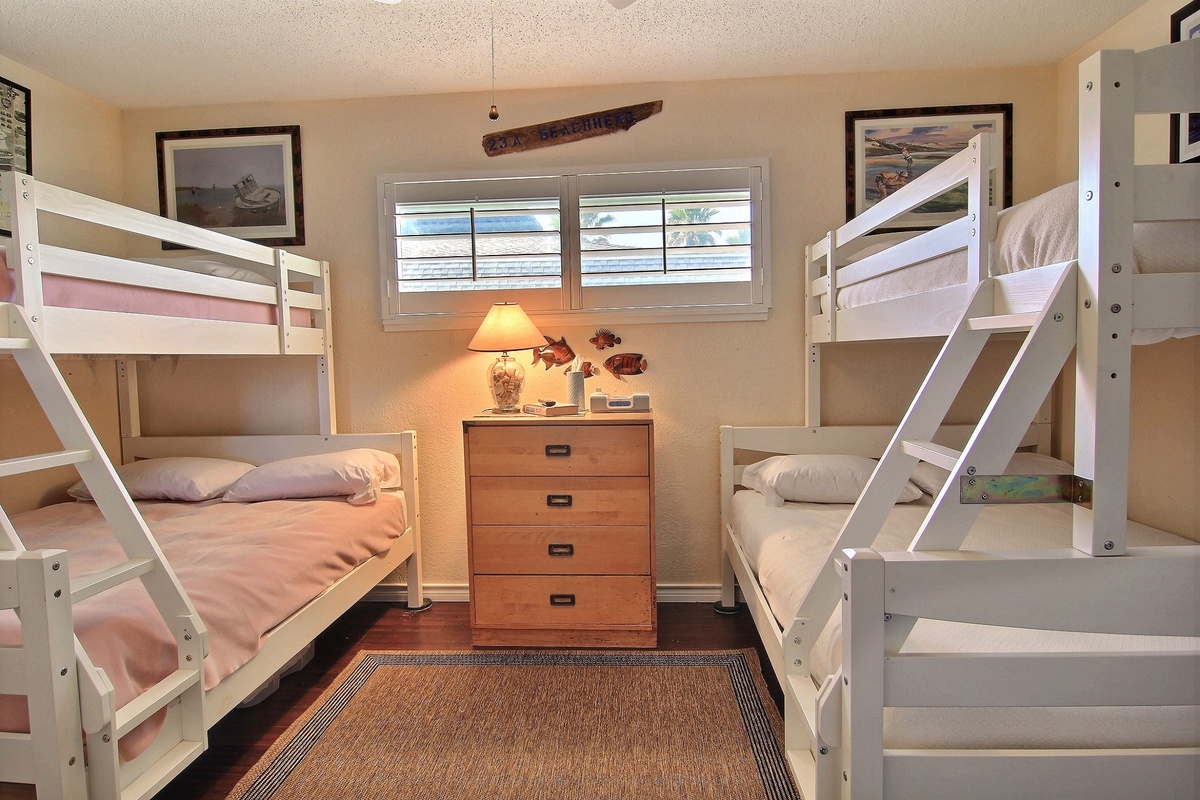 Your spacious bunk room sleeps four with comfortable beds, warm lighting, and charming rustic touches that make bedtime an adventure.