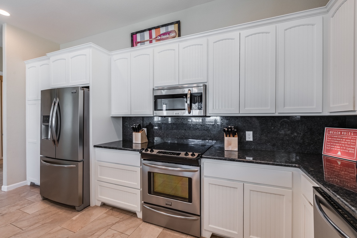 Your fully equipped kitchen features modern stainless steel appliances and granite countertops, perfect for preparing meals during your stay.