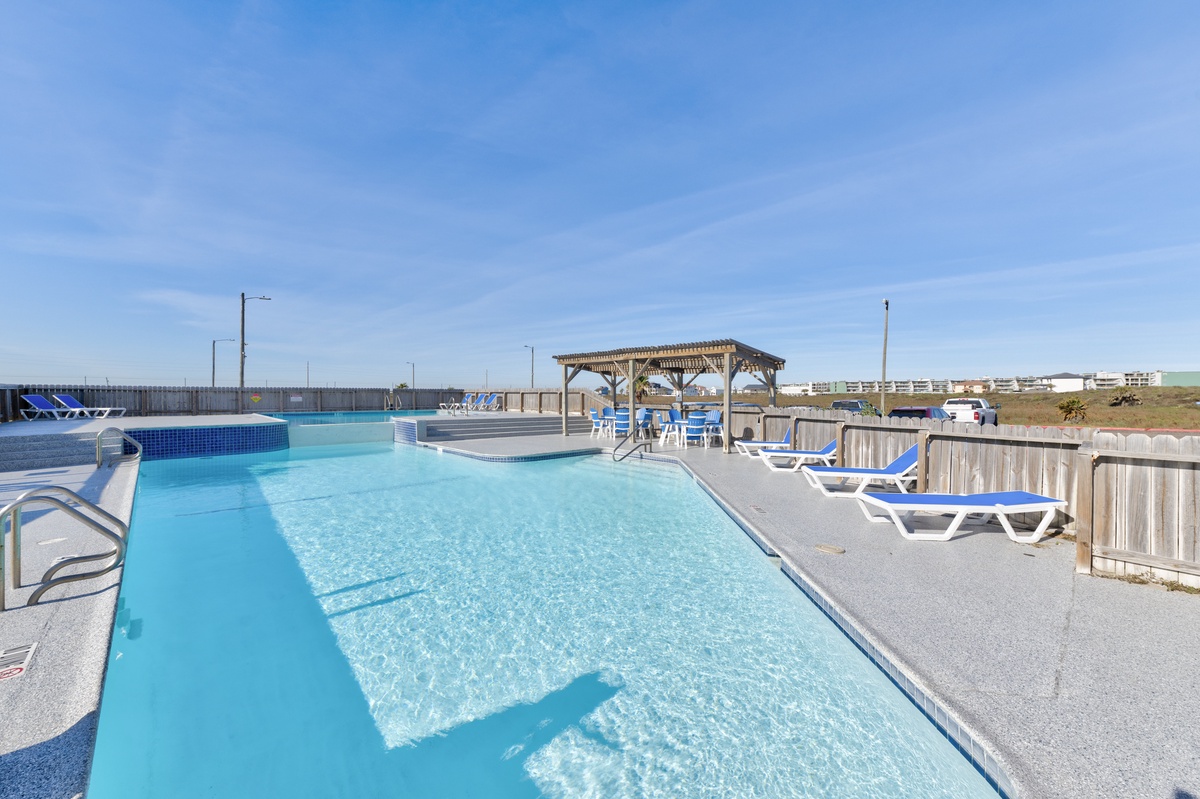 Dive into crystal-clear waters in your private pool, with sunny loungers and a shaded gazebo for perfect relaxation.