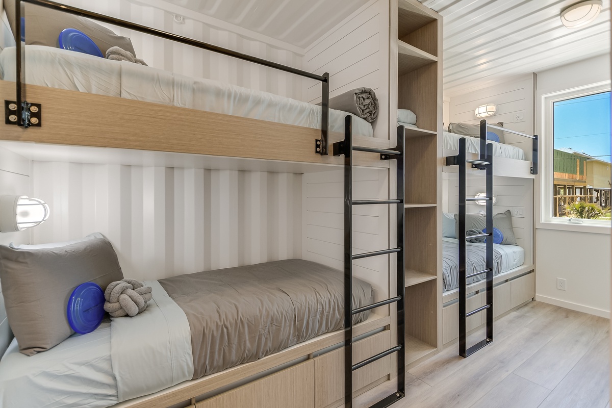 Your kids will love these cozy bunk beds with individual reading lights and privacy curtains for the perfect bedtime adventure.