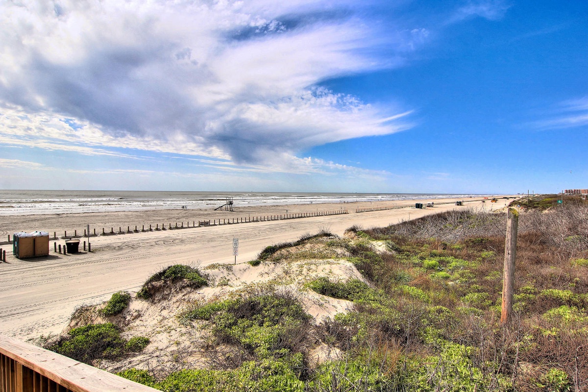 Expansive sandy coastline stretches toward the horizon