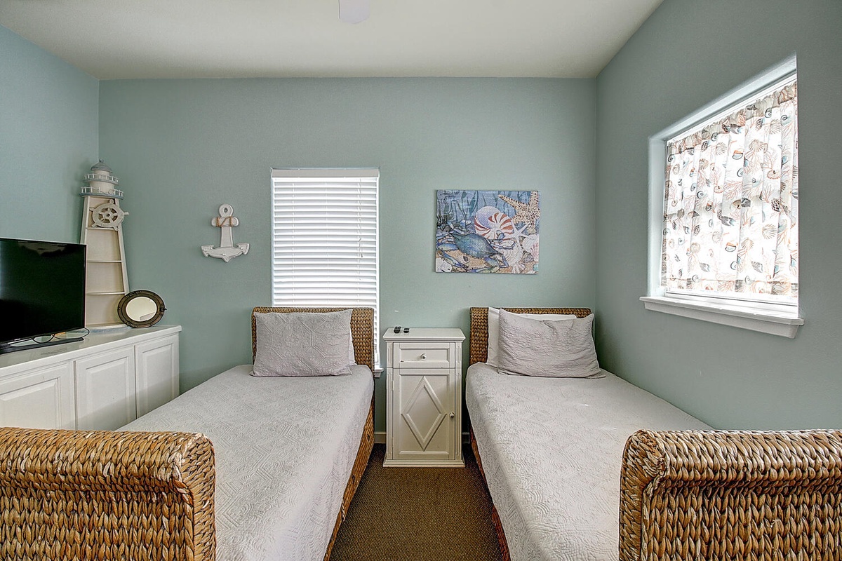 Drift off in your coastal twin bedroom with nautical charm, woven textures, and soothing sea-glass walls.