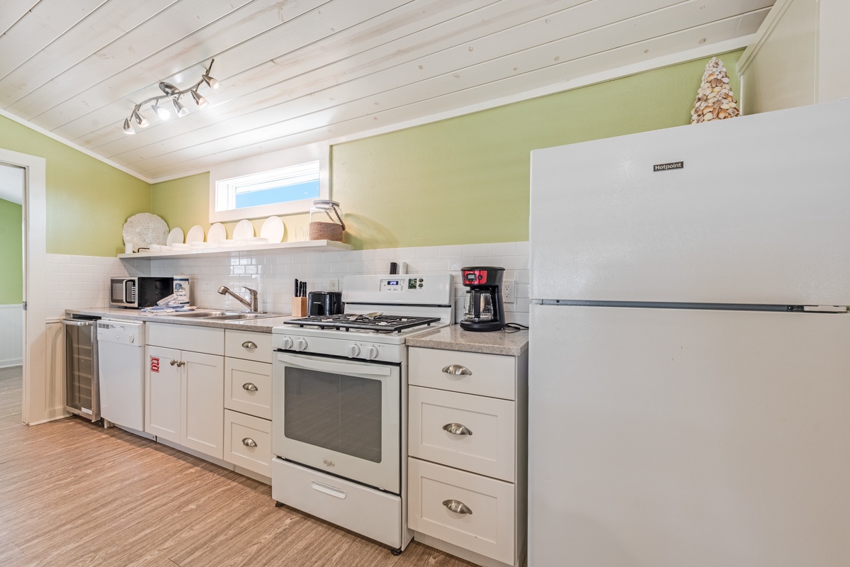 Whip up your favorite meals in this fully equipped kitchen featuring modern appliances and plenty of counter space for culinary adventures.