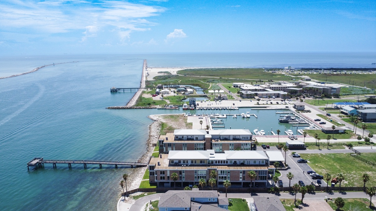 Coastal community featuring waterfront properties with marina access and pristine shoreline.