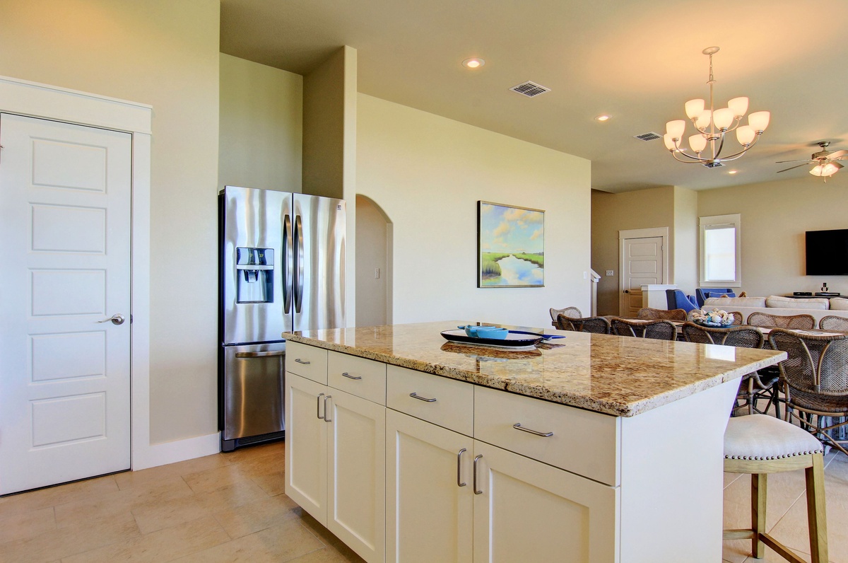 Your spacious kitchen island becomes the heart of your getaway, perfect for preparing meals and gathering with loved ones.