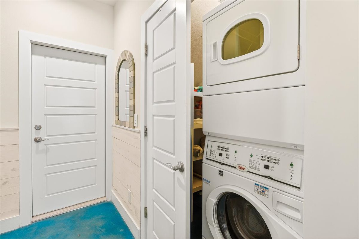 Your private laundry nook keeps essentials organized and convenient. The stackable washer and dryer handle all your travel needs effortlessly.