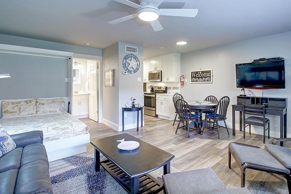Relax in your thoughtfully designed open-concept space with modern kitchen, cozy dining area, and entertainment center.