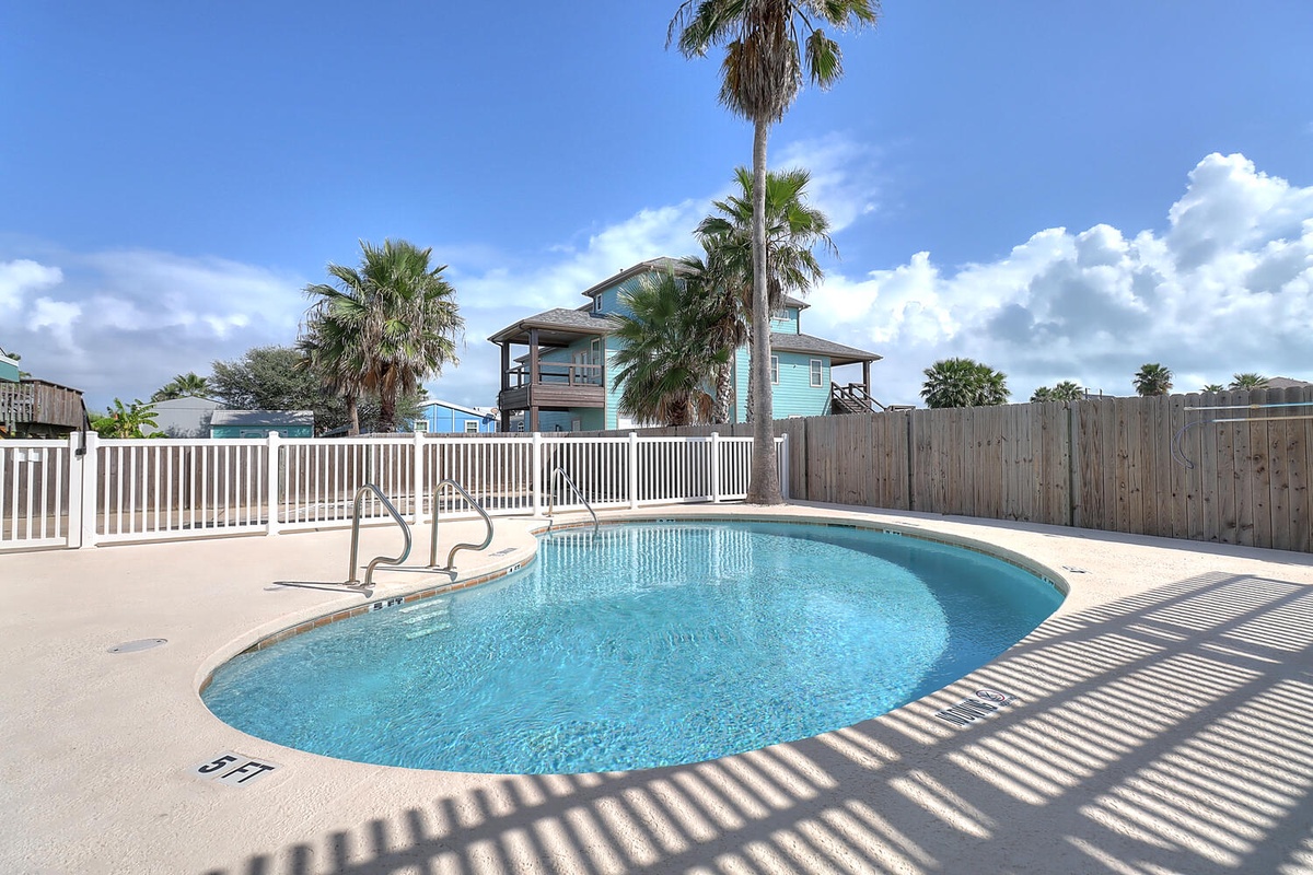 Dive into your private tropical oasis! Crystal-clear waters sparkle under swaying palms, creating the perfect backdrop for lazy afternoons.