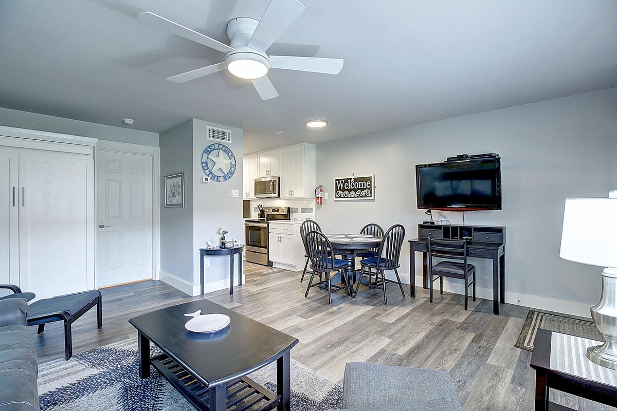 Your open-concept living space combines comfort with convenience, featuring a fully equipped kitchen, dining area, and cozy seating.