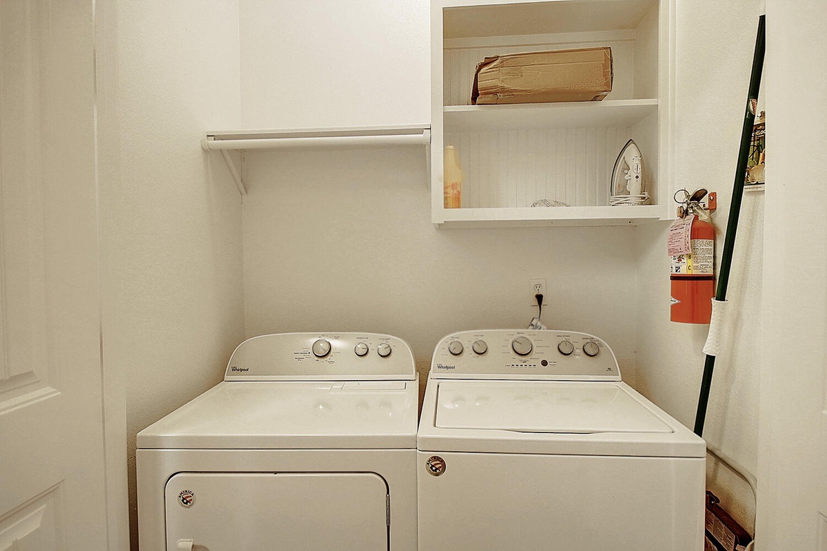 Your dedicated laundry room makes extended stays effortless with a full-sized washer and dryer, plus convenient storage shelving.